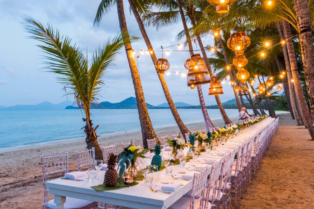 Tables on beach outside NuNu at Palm Cove