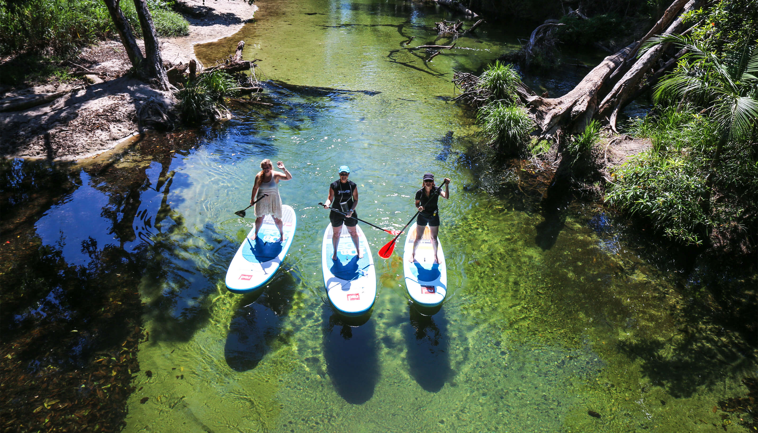 stand up paddle boarding on creek