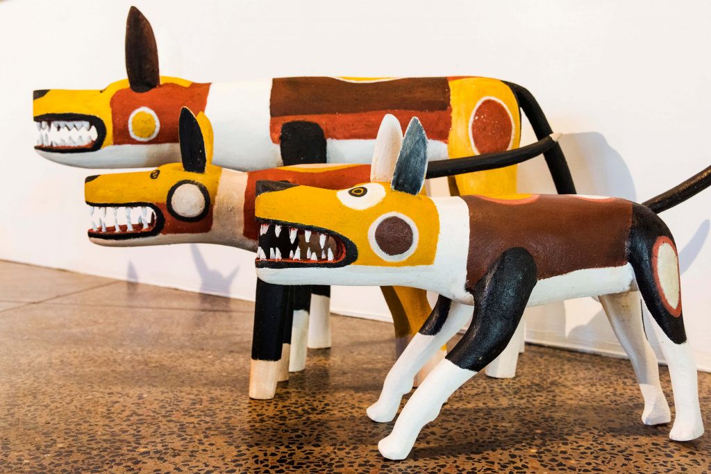 Aurukun dog sculptures at the cairns indigenous art fair