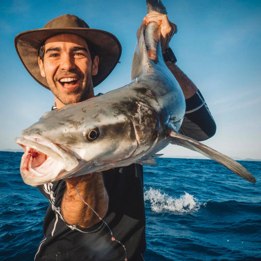 Fisherman holding fish